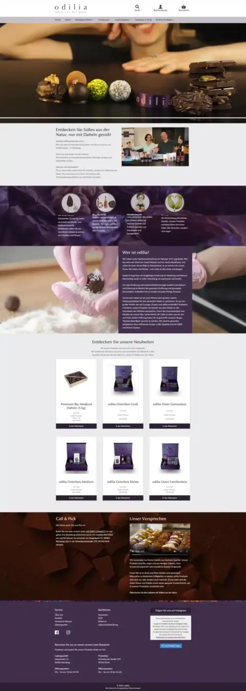 Screenshot der Gourmet Schokoladen Website von Odilia vor dem Relaunch. Oben ist eine Auswahl an Trüffeln zu sehen. Die Seite enthält Bilder von Schokolade in verschiedenen Formen, einen Abschnitt über die Marke und eine Produktliste mit verschiedenen Schokoladenpackungen zum Verkauf.